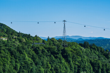 Cable Car Over Solina Lake Dam at Dusk with Full Moon in the Background, Bieszczady Mountains, Poland