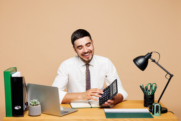 Young happy fun successful employee business man wear white shirt tie sit work at office desk with...