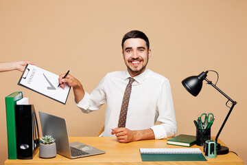 Young employee business man wear white shirt tie sit work at office desk with pc laptop sign...