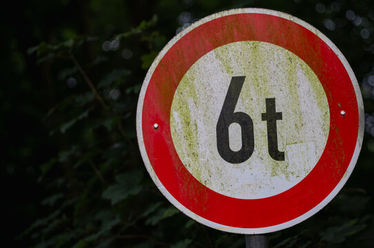 Weathered weight limit sign showing six tons maximum permitted load