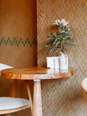 Cozy corner with wooden table and minimalist decor in a contemporary cafe setting