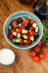 Fresh vegetable salad with cucumbers and cherry tomatoes