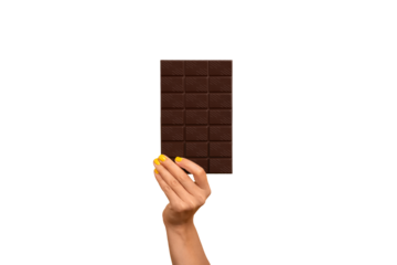 Woman’s hand holding a dark chocolate bar isolated.