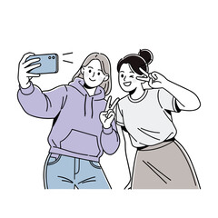 Fototapeta premium Two happy young women friends taking a selfie with a mobile phone, posing with peace signs