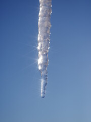A long icicle hanging from the sky