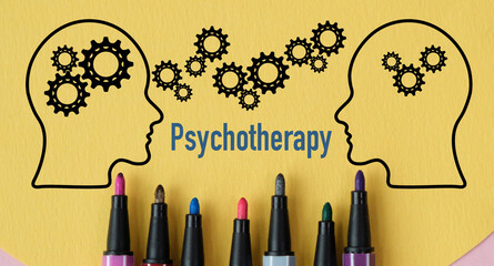 A drawing of two heads with gears and the word Psychotherapy written below