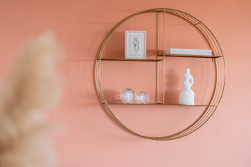 Minimalist round wall shelf with modern decor on pastel coral background — stylish interior design detail for elegant living spaces