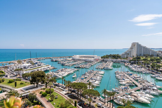 Aerial view of Marina Baie des Anges in Villeneuve-Loubet &ndash; luxury yachts, turquoise water, iconic pyramid buildings and Mediterranean Sea on the French Riviera