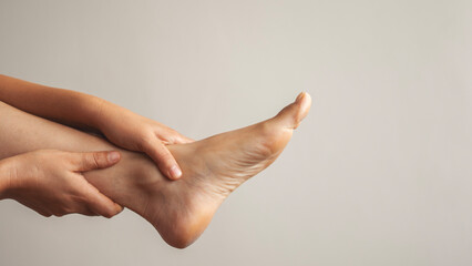 Foot pain, woman suffering from feet ache