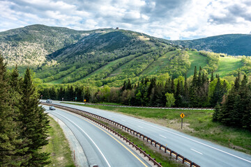 A beautiful view of mountains with lots of lush plants and trees in White Mountain National Forest.