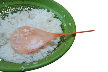 rice in a bowl Plastic spoon with leftover white rice, placed on a plain white background