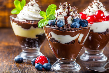 Decadent desserts: Chocolate pudding parfaits with whipped cream and fresh fruit.