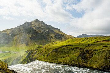mountain landscape in the mountains of South Iceland with waterfall