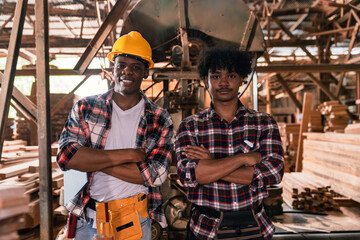 Factory Worker Portrait Of Two African American Woodworkers Smiling With Arms Crossed In Timber Workshop Showing Pride And Confidence