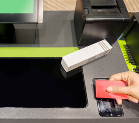  buying make up at cosmetics section in store,self checkout systems in  retail stores,Barcode scanner,Self checkout machine