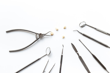 Dental equipment tools for teeth care on white background. Professional Dentist desktop, top view