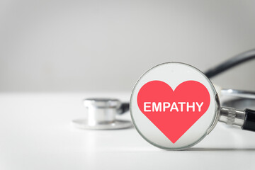 Empathy in healthcare concept. Stethoscope with a heart icon symbolizing compassionate patient care. The importance of the doctor-patient relationship, understanding, support, and kindness.