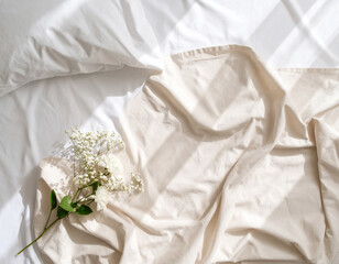 soft sunlight casting shadows on linen bedsheet, cozy atmosphere, beige and white tone