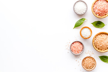 Spa composition with many different kinds of sea salt in bowls, top view