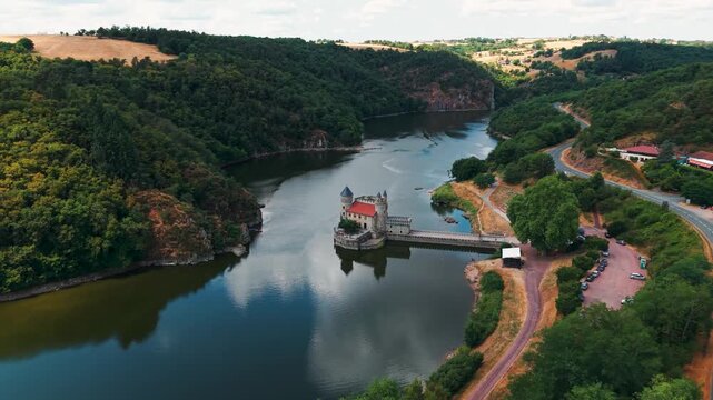 aerial shot around Chateau de la Roche on the Loire river near Roanne city in Loire departement, Auvergne Rhone Alpes region, France