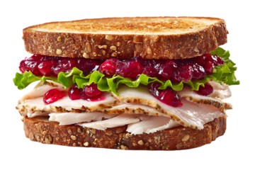 On transparent background a perfectly assembled turkey sandwich with cranberry sauce cheese and lettuce is