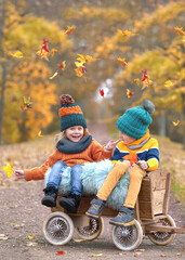 Autumn Bliss: Laughing Children Amid Vibrant Fall Colors
