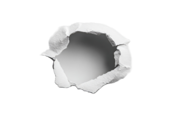 A circular hole punched through white paper.  Crisp edges and torn paper surrounding the void