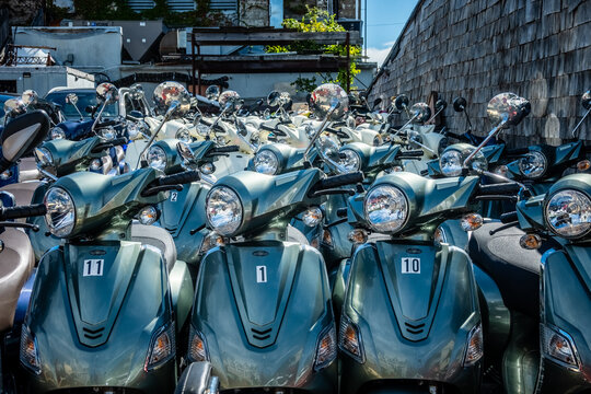 scooters on city street available for rent and ride