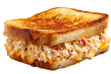 On transparent background a vibrant tuna sandwich with melted cheese and chopped red peppers mixed into the