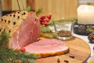 Christmas baked ham on a wooden board.Christmas in Sweden.