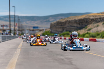 vibrant karting scene featuring children racing on colorful outdoor track