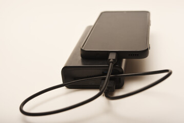 Charging a mobile phone from a powerbank. Charging the gadget.