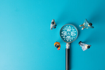 A business team analyzing Artificial Intelligence (AI). Miniature people focus on an AI brain icon, a concept for digital transformation, future technology, and strategic implementation.