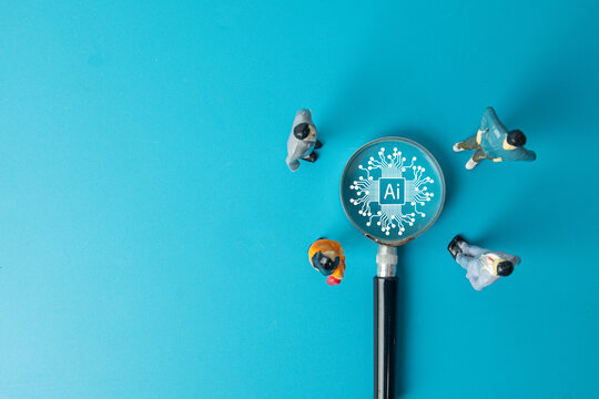 A business team analyzing Artificial Intelligence (AI). Miniature people focus on an AI brain icon, a concept for digital transformation, future technology, and strategic implementation.