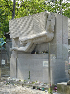 Paris, France &ndash; June 30, 2014. Tomb of Irish poet and playwright Oscar Wilde, surrounded by glass barrier, at Pere Lachaise cemetery in Paris.