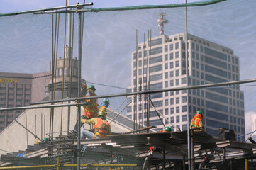 Naklejka premium construction workers on construction site