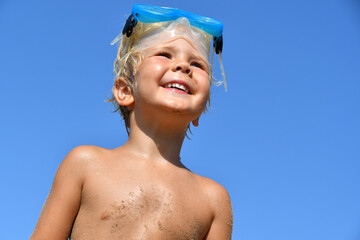 Little Boy in Snorkel Mask Smiling at the Beach