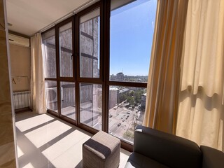 Sunny City View from Modern Apartment Window