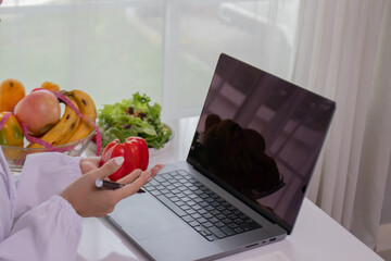 A female lab technician examines broccoli for scientific research in microbiology, biotechnology, and nutrition to advance health.