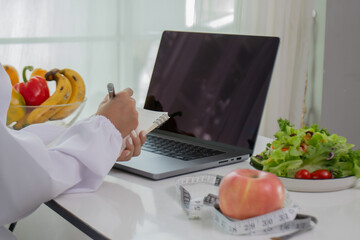 A female lab technician examines broccoli for scientific research in microbiology, biotechnology, and nutrition to advance health.