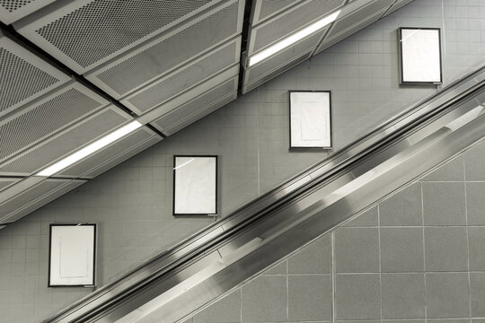 Four big vertical / portrait orientation blank billboard with escalator background.