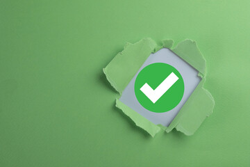 Quality control and assurance,approval concept. A green approved check mark symbolizes passing a...