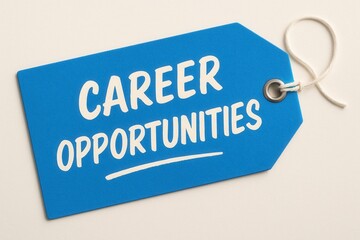 A blue tag with white text reading "Career Opportunities" featuring a looped string, symbolizing job openings and employment potential.