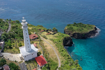 White Lighthouse by the Ocean Shore in Amed, Bali
