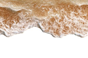 Close-up of foamy, light beige waves on a beach, against a black background