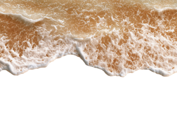 Close-up of foamy, light beige waves on a beach, against a black background
