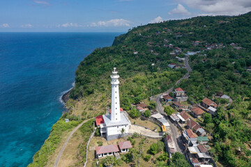 White Lighthouse by the Ocean Shore in Amed, Bali
