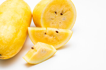Yellow Watermelon Cut into Pieces on White Background