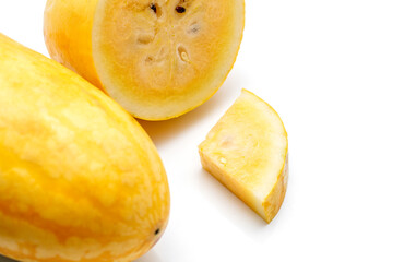 Yellow Watermelon Cut into Pieces on White Background