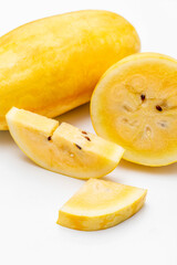 Yellow Watermelon Cut into Pieces on White Background